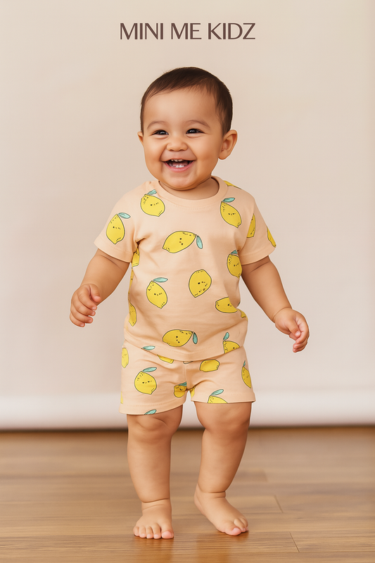 This is a cute and playful toddler clothing set featuring a peach-colored short-sleeve t-shirt and matching shorts.