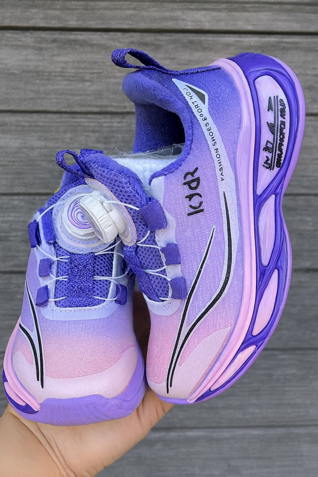 Bold turquoise-black sneakers with futuristic soles, perfect for your little explorer.