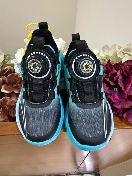 Bold turquoise-black sneakers with futuristic soles, perfect for your little explorer.