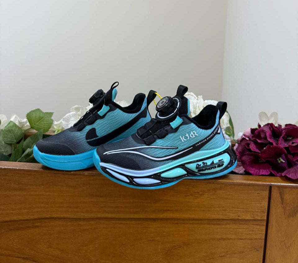 Bold turquoise-black sneakers with futuristic soles, perfect for your little explorer.