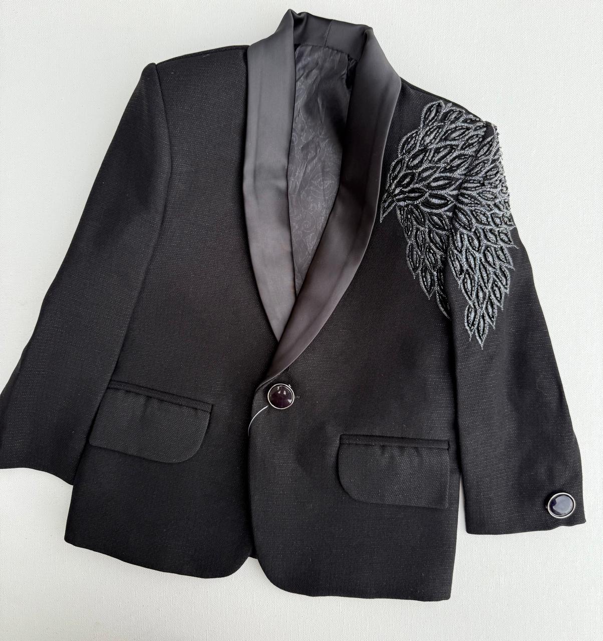 Premium black tuxedo with elegant embroidery – perfect for your little gentleman’s grand occasions.