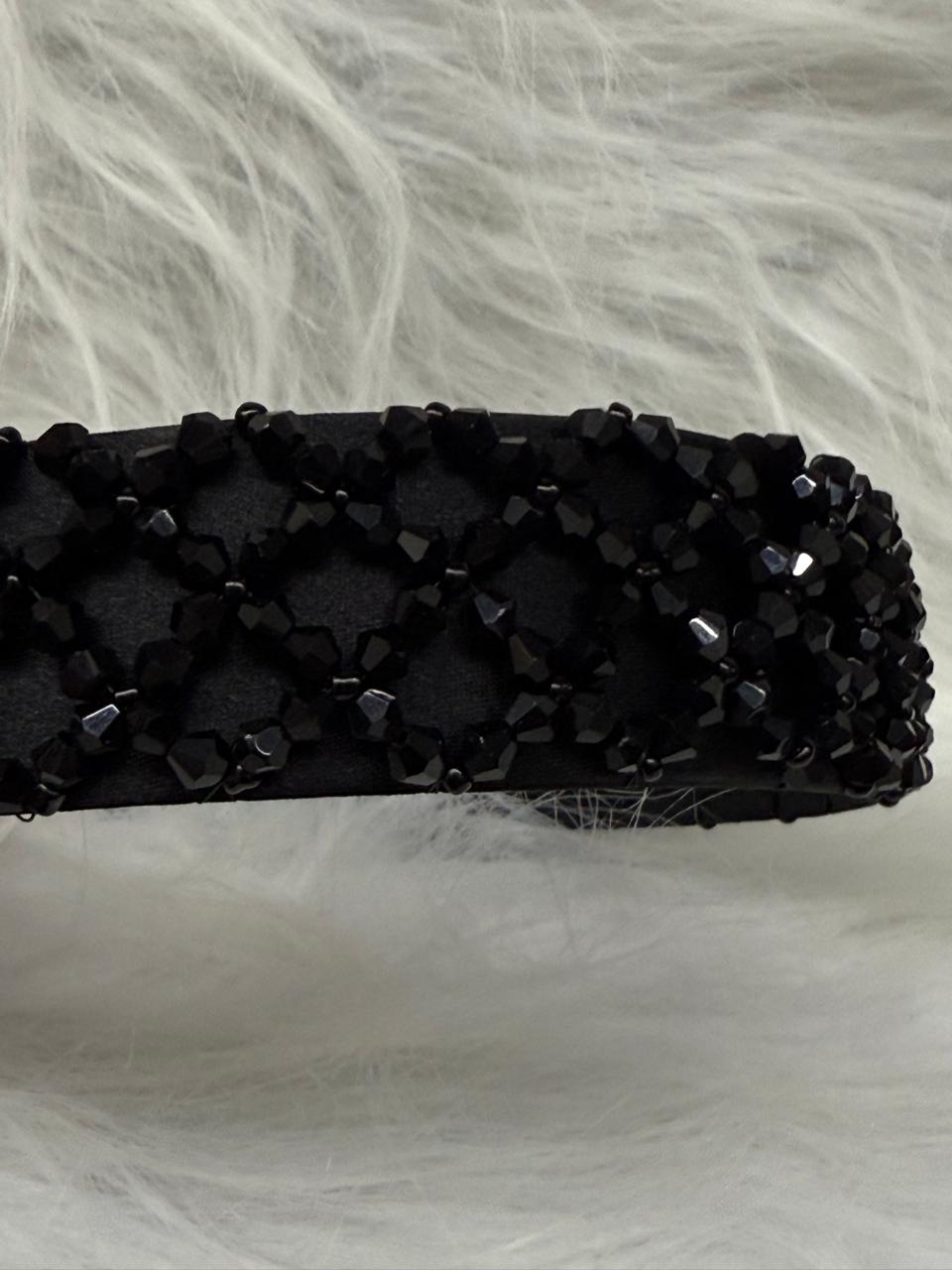 "Shine with elegance – a navy satin beaded headband that completes every look."