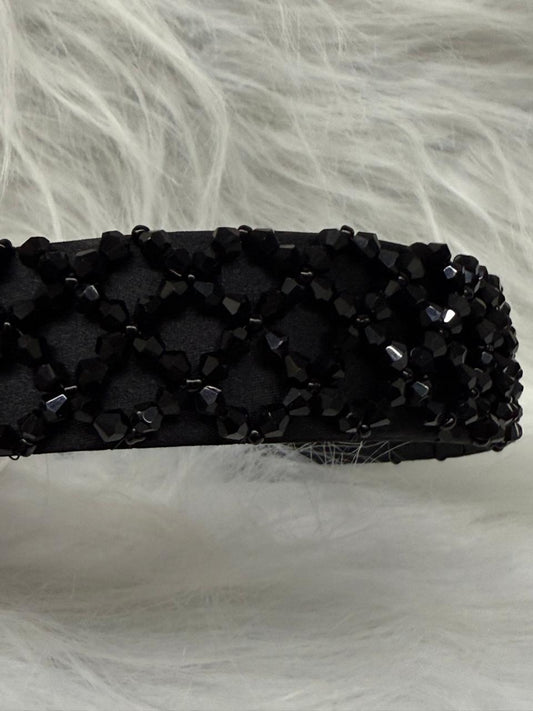 "Shine with elegance – a navy satin beaded headband that completes every look."
