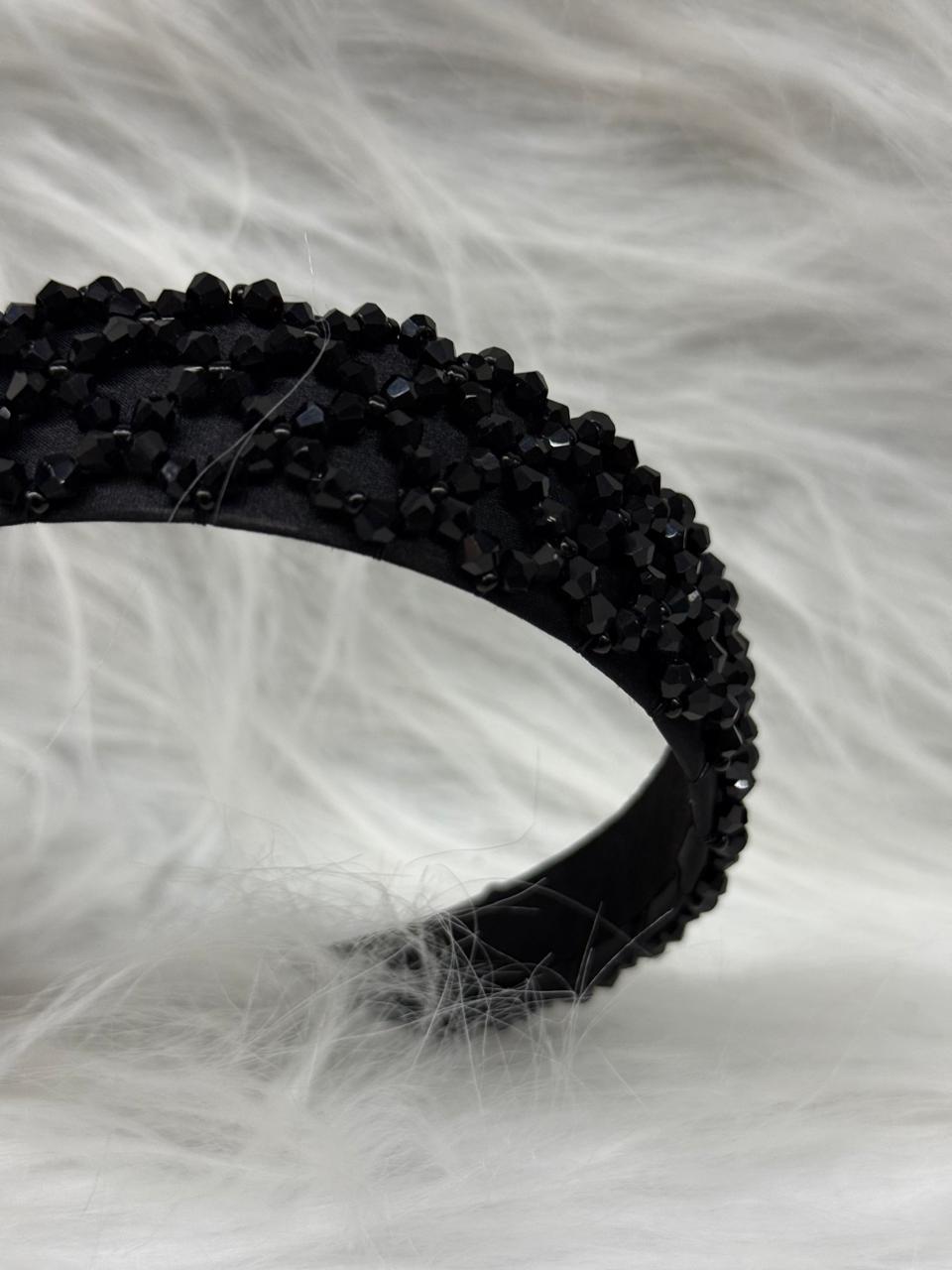 "Shine with elegance – a navy satin beaded headband that completes every look."