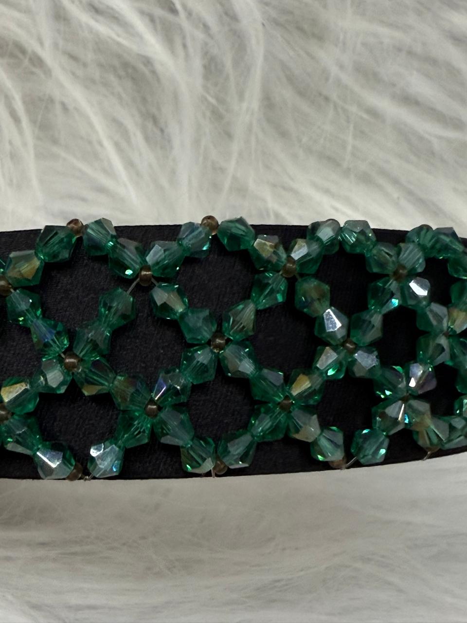 "Shine with elegance – a navy satin beaded headband that completes every look."