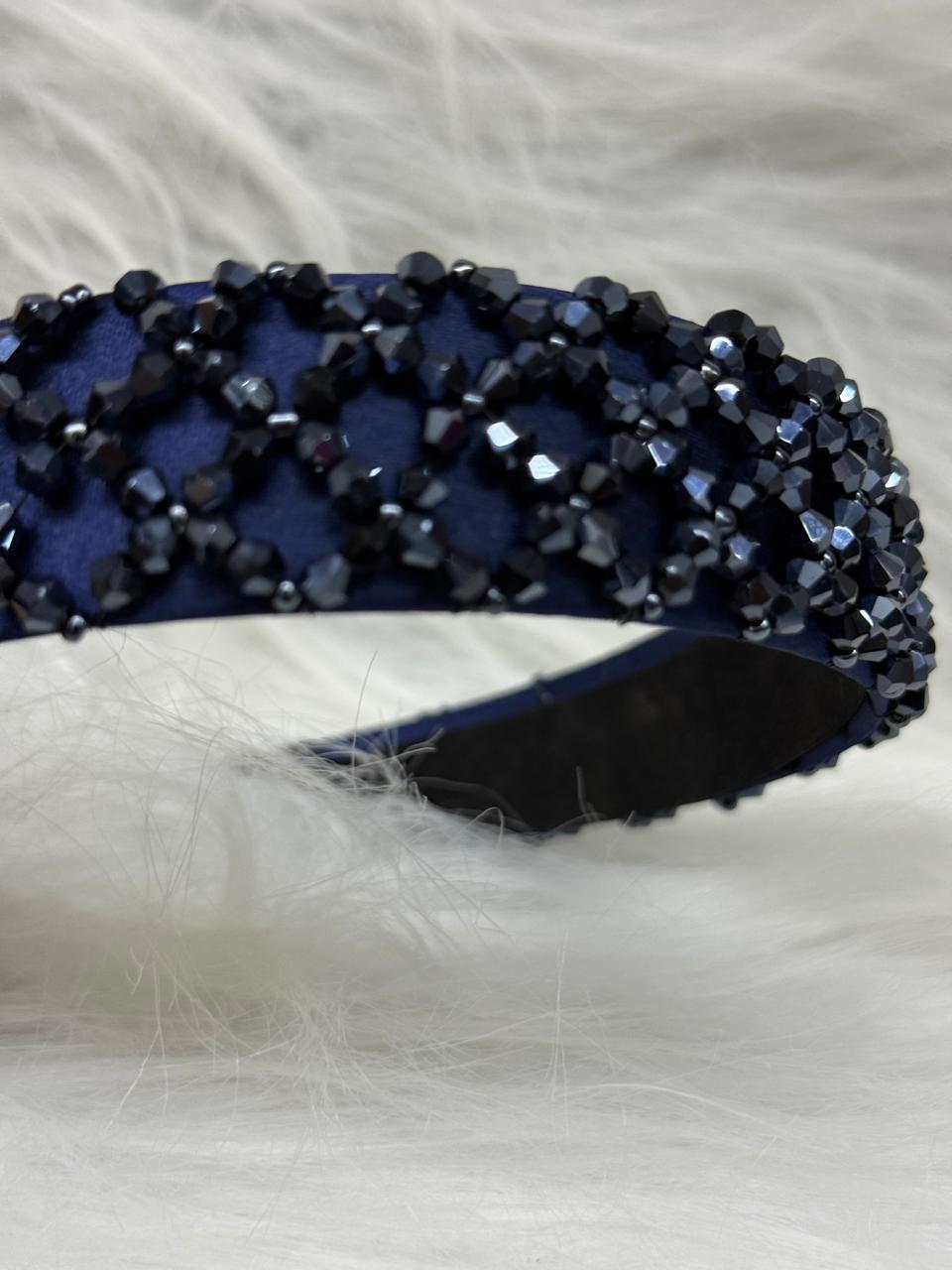 "Shine with elegance – a navy satin beaded headband that completes every look."