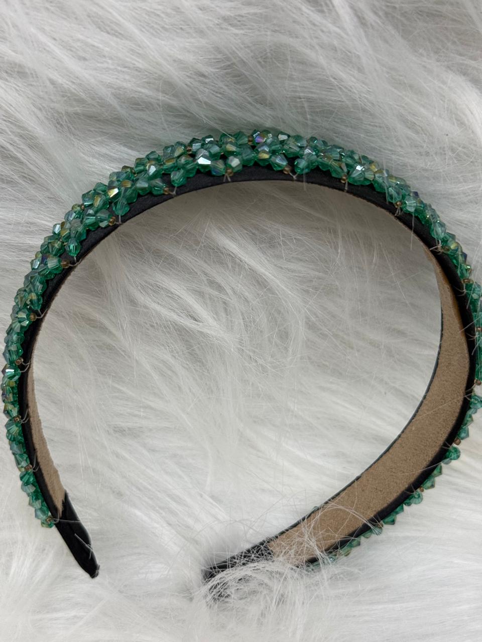 "Shine with elegance – a navy satin beaded headband that completes every look."