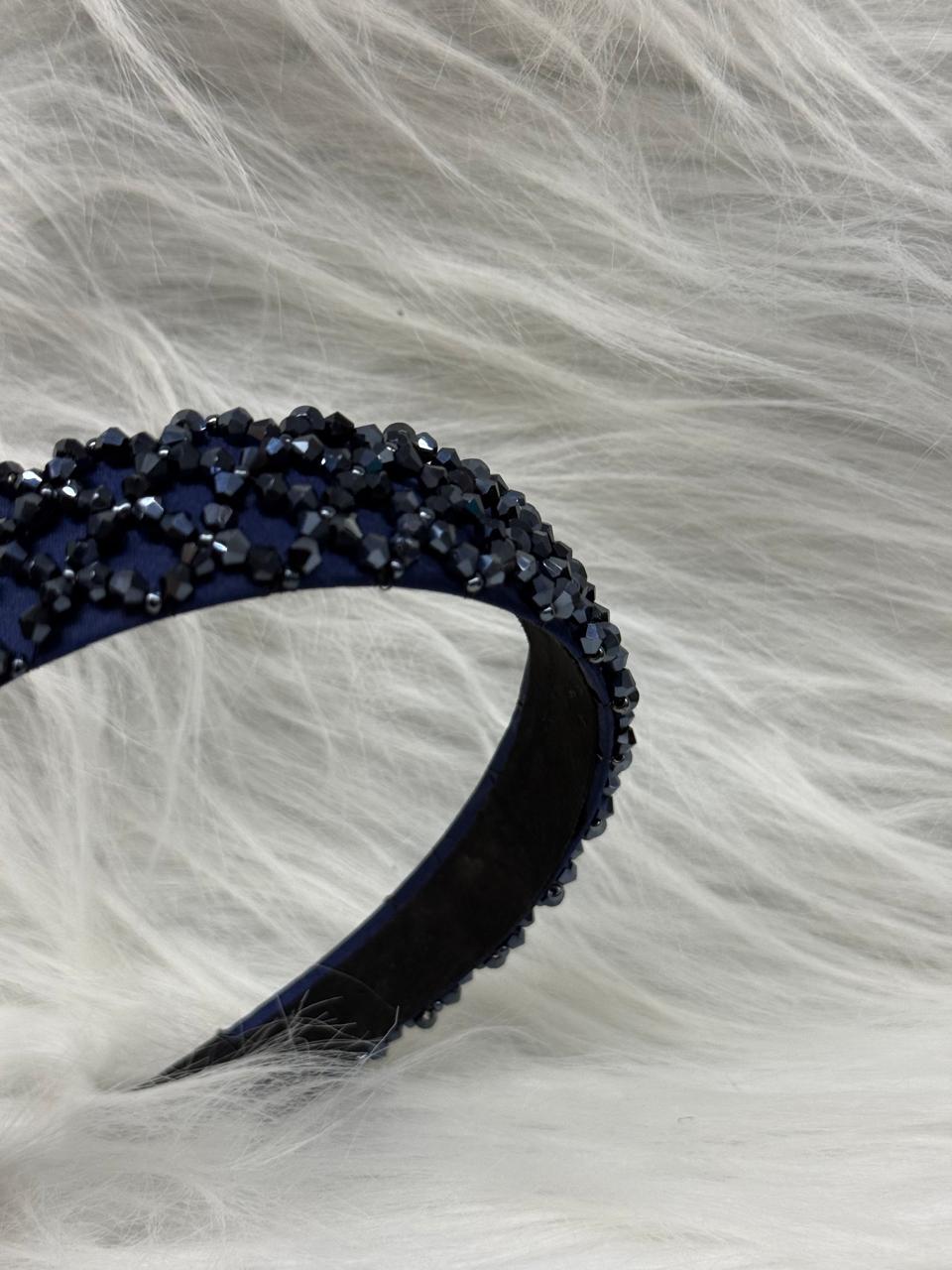 "Shine with elegance – a navy satin beaded headband that completes every look."