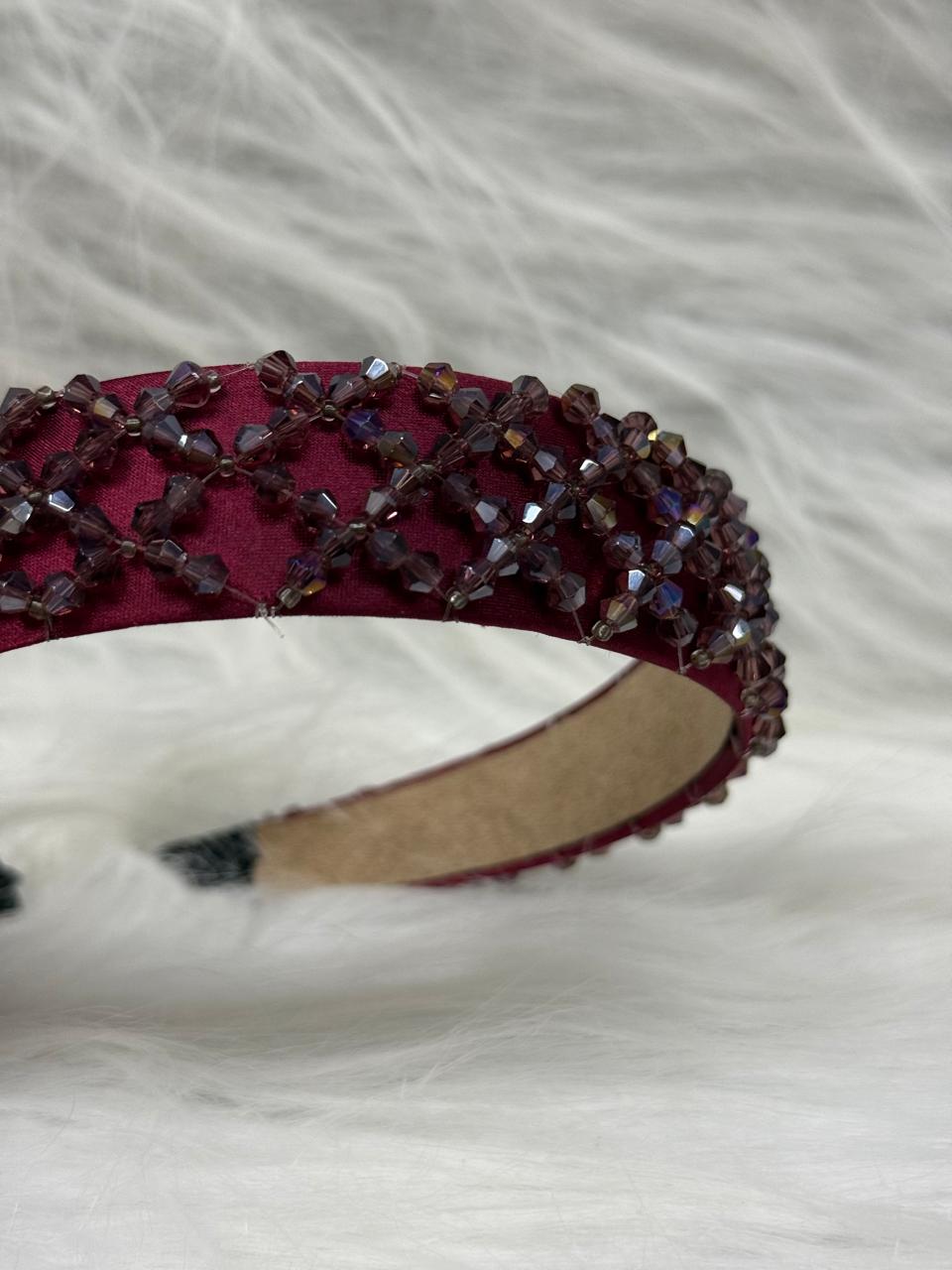 "Shine with elegance – a navy satin beaded headband that completes every look."