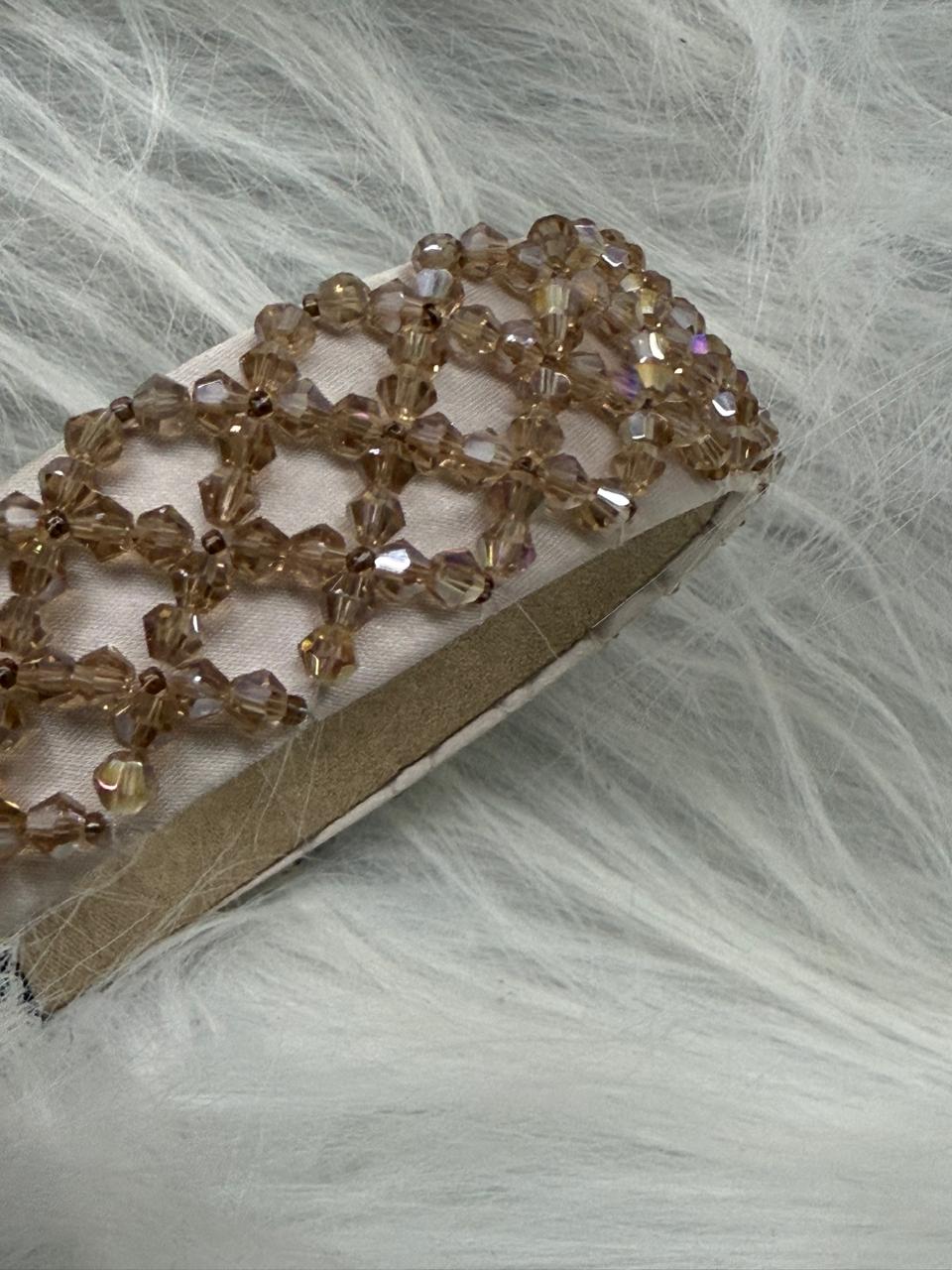 "Shine with elegance – a navy satin beaded headband that completes every look."