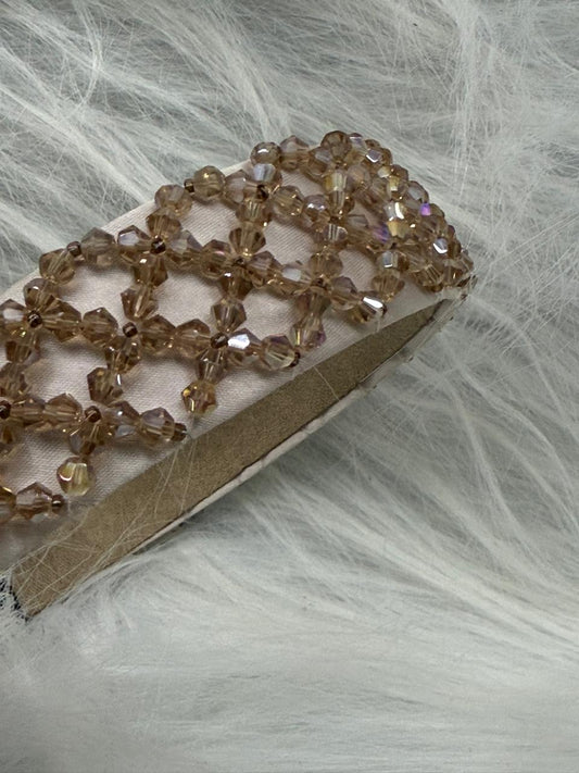 "Shine with elegance – a navy satin beaded headband that completes every look."