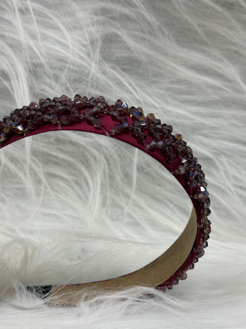 "Shine with elegance – a navy satin beaded headband that completes every look."