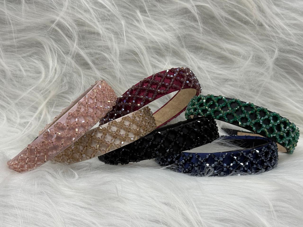 "Shine with elegance – a navy satin beaded headband that completes every look."