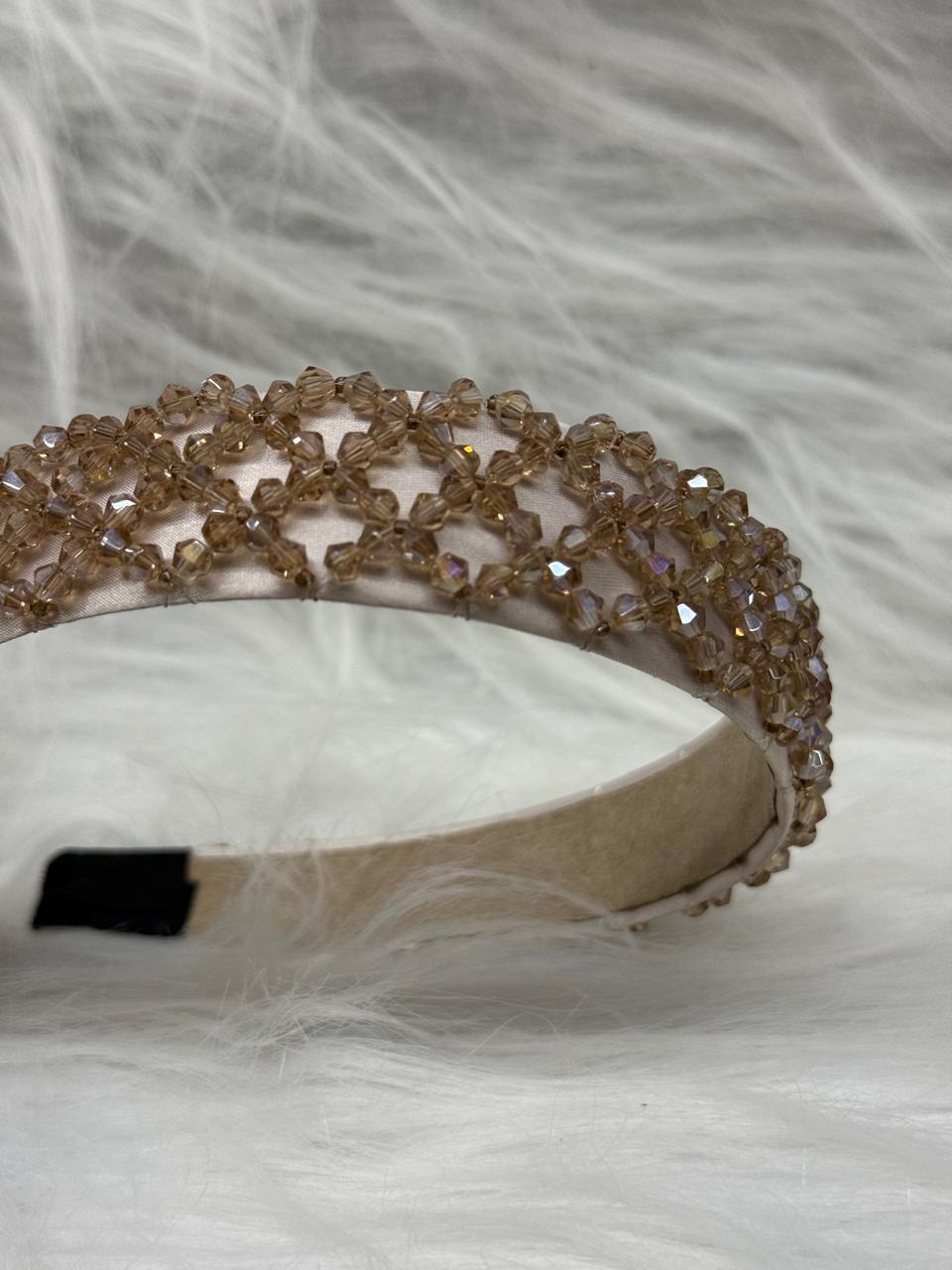 "Shine with elegance – a navy satin beaded headband that completes every look."