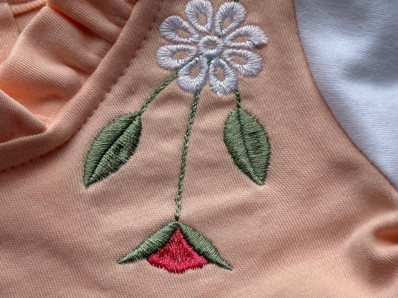 “Dress your little angel in comfort and style with this peach blossom outfit set.”