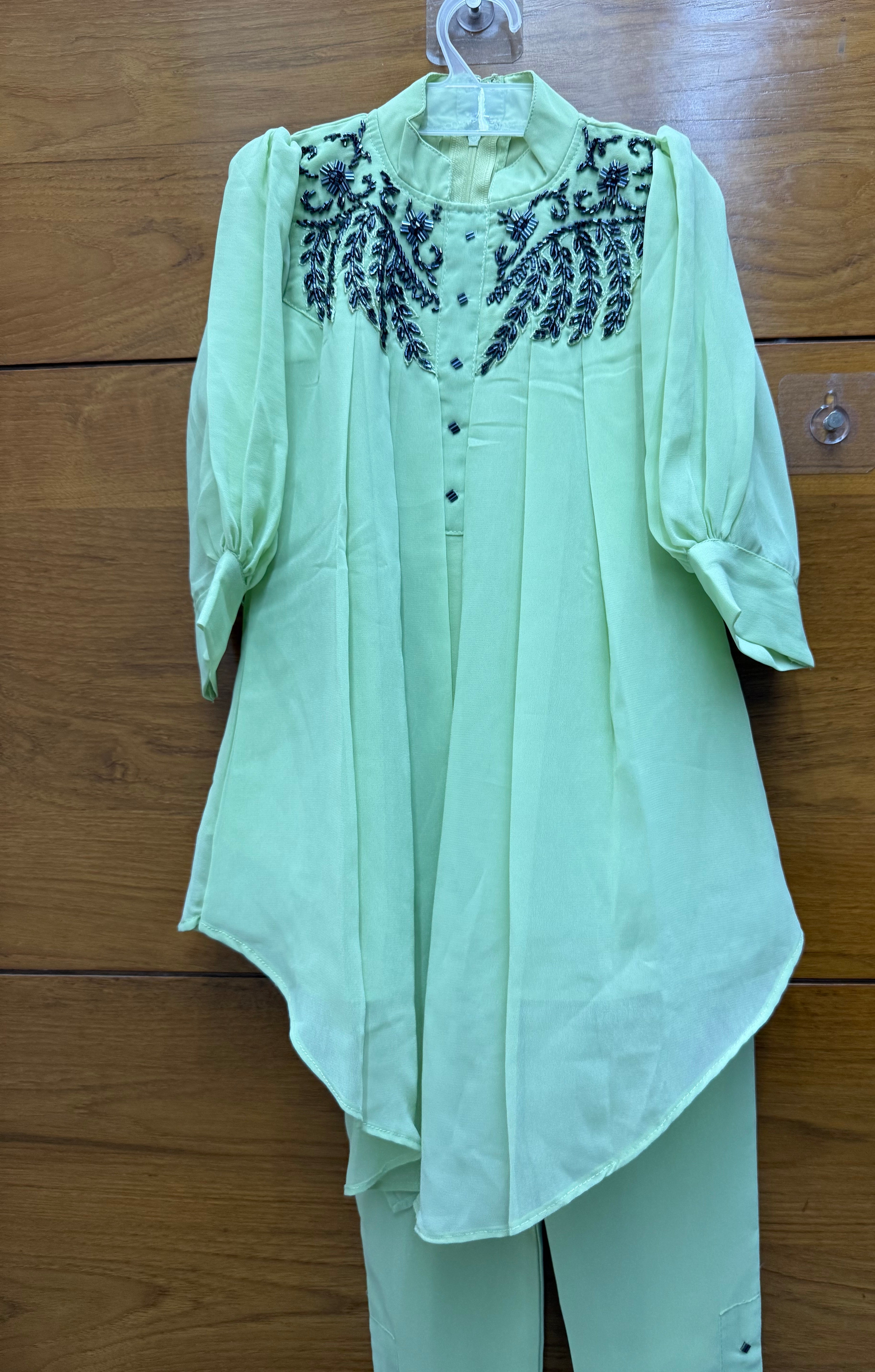 Stylish asymmetrical kurti and pant with hand-embroidered black thread and beadwork on the yoke