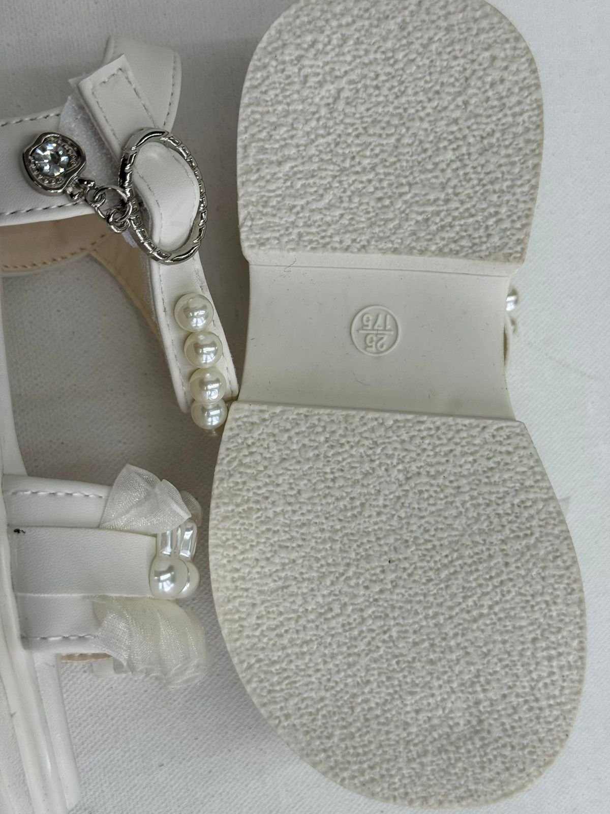 Step into cuteness with our pearl bunny ruffle sandals!"