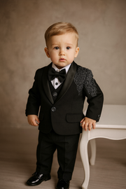 Premium black tuxedo with elegant embroidery – perfect for your little gentleman’s grand occasions.